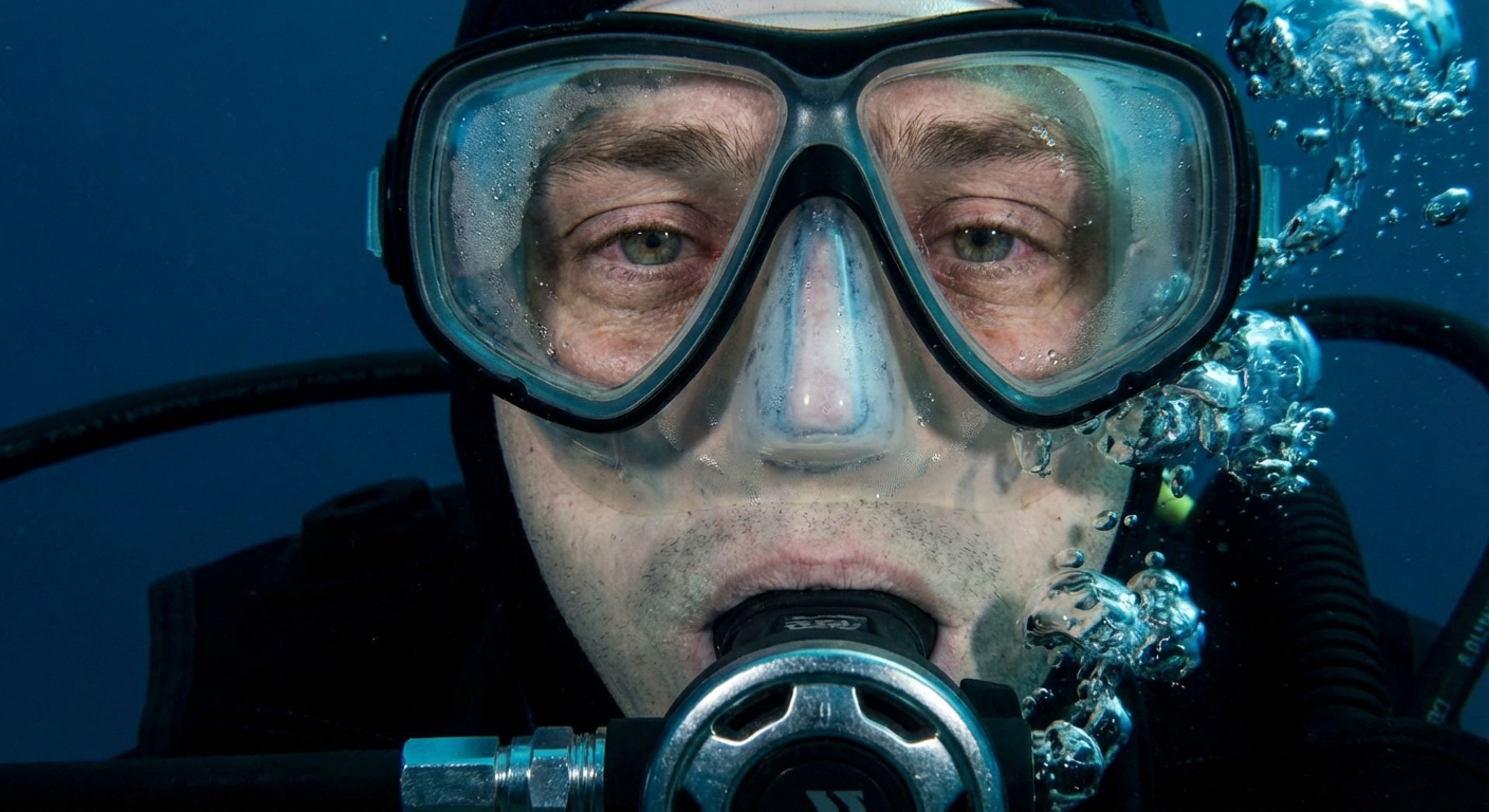 Diver looking at gauge with condensation
