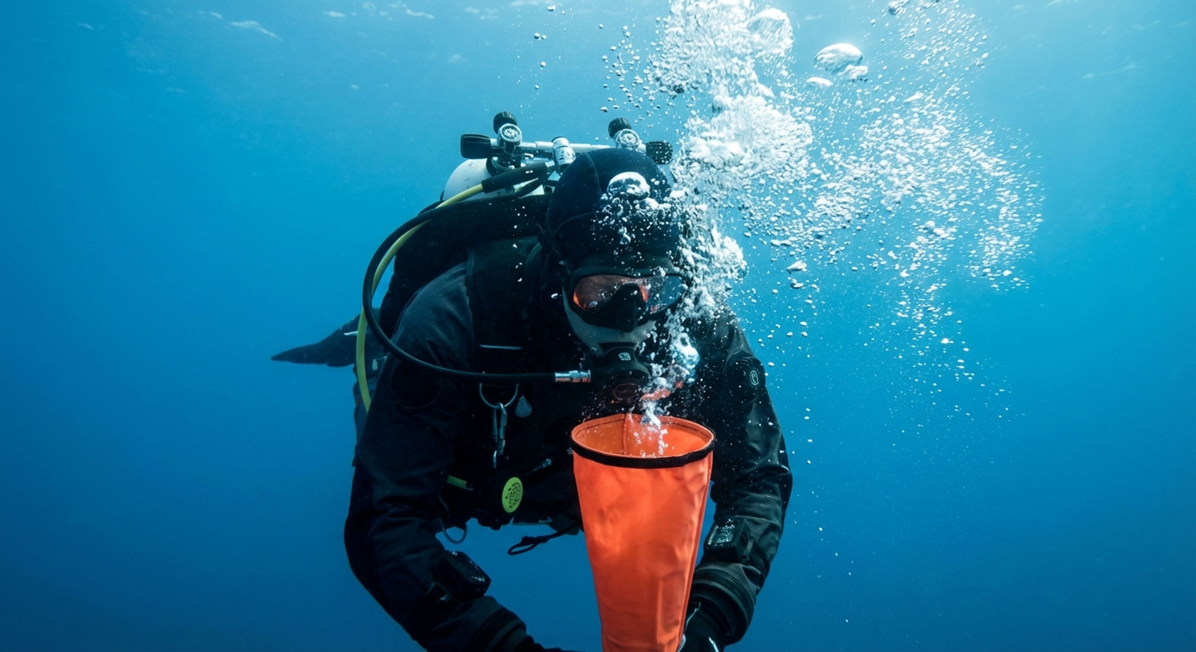 Diver inflating SMB with regulator
